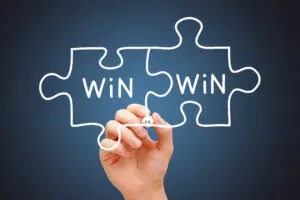 Hand drawing connected puzzle pieces labeled 'Win Win'.